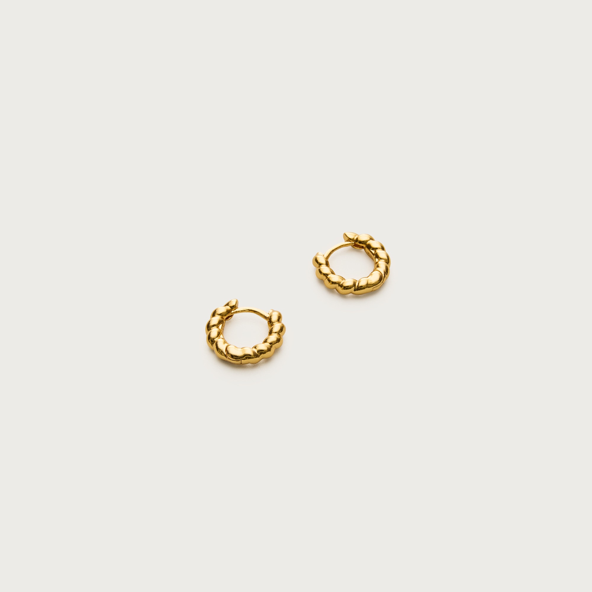 Mini metallic twist huggie earrings