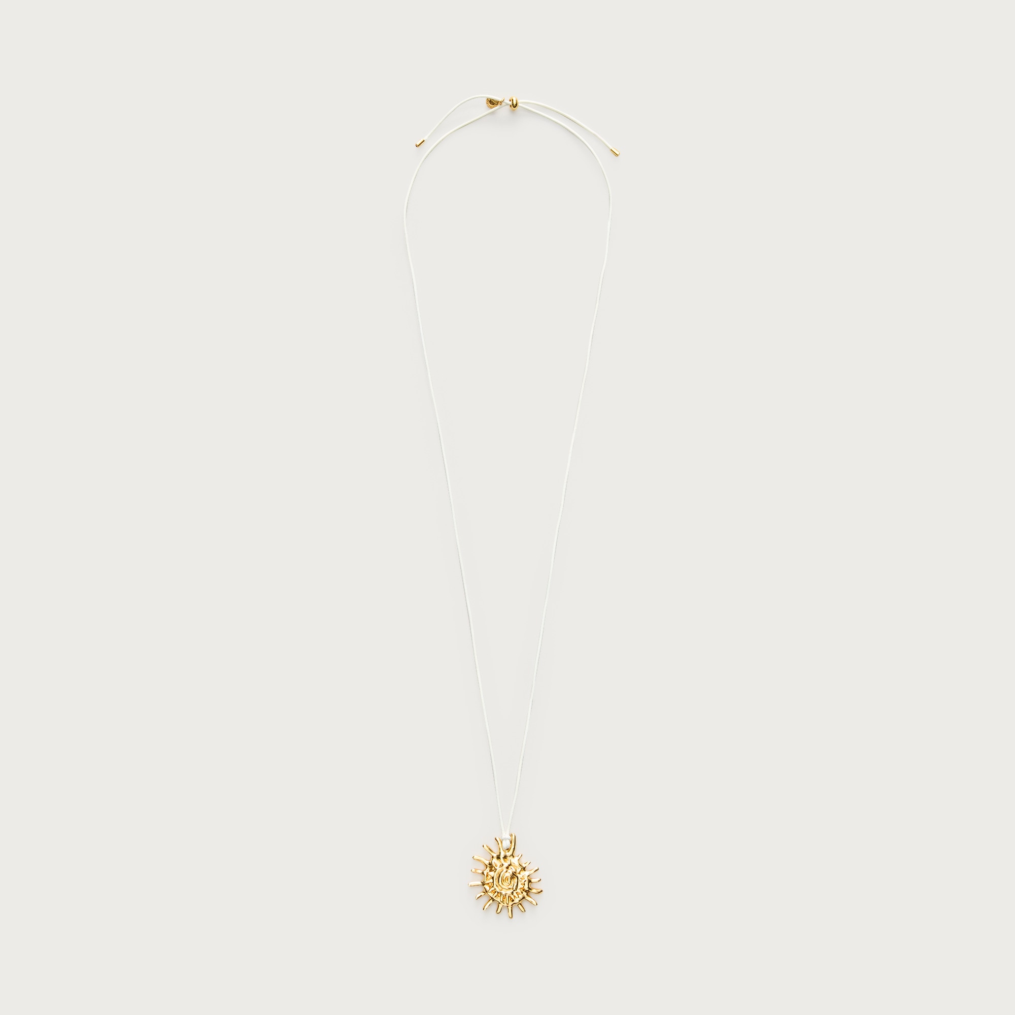 Metallic sun pendant necklace from J.Crew - $67