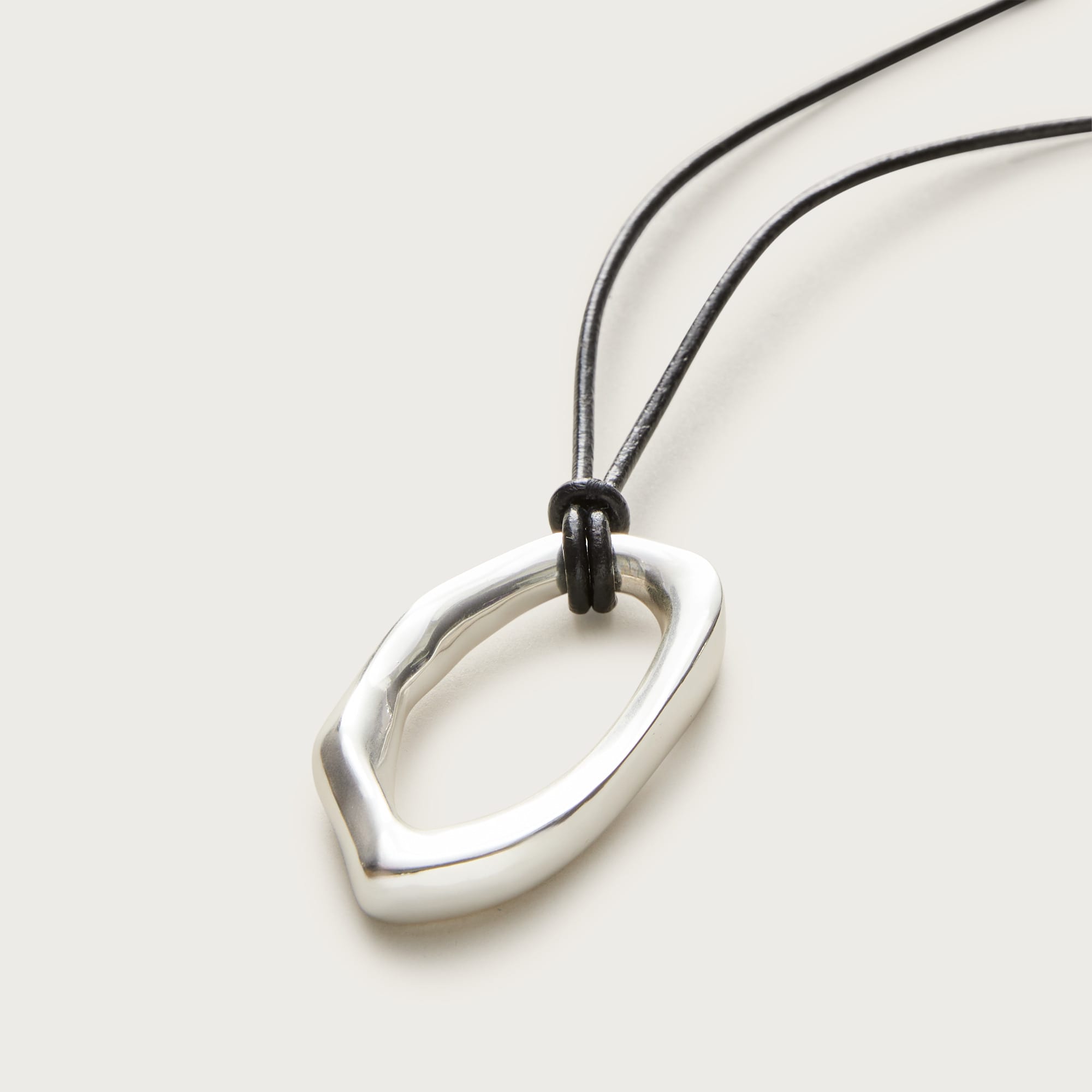 Oval pendant necklace with leather cord