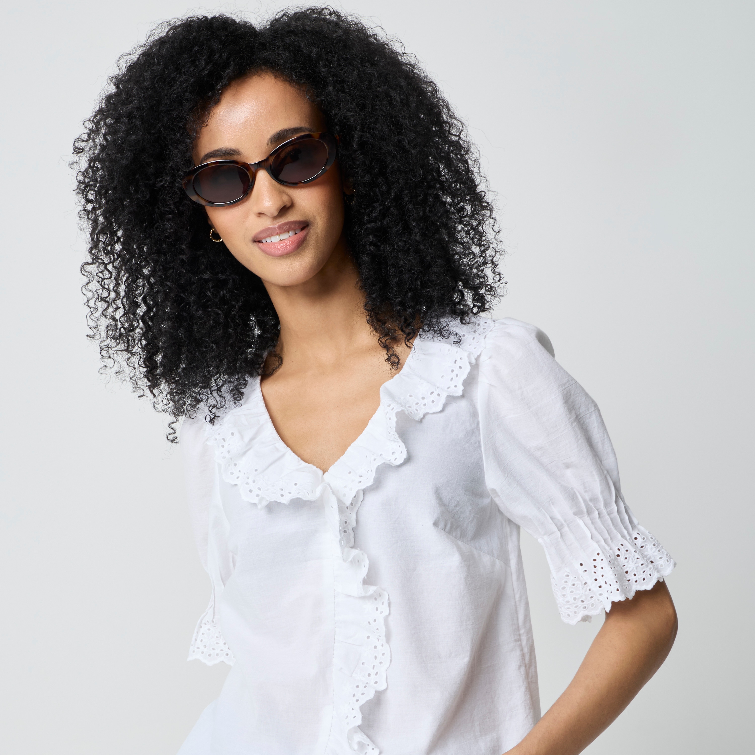 Eyelet ruffle-front top