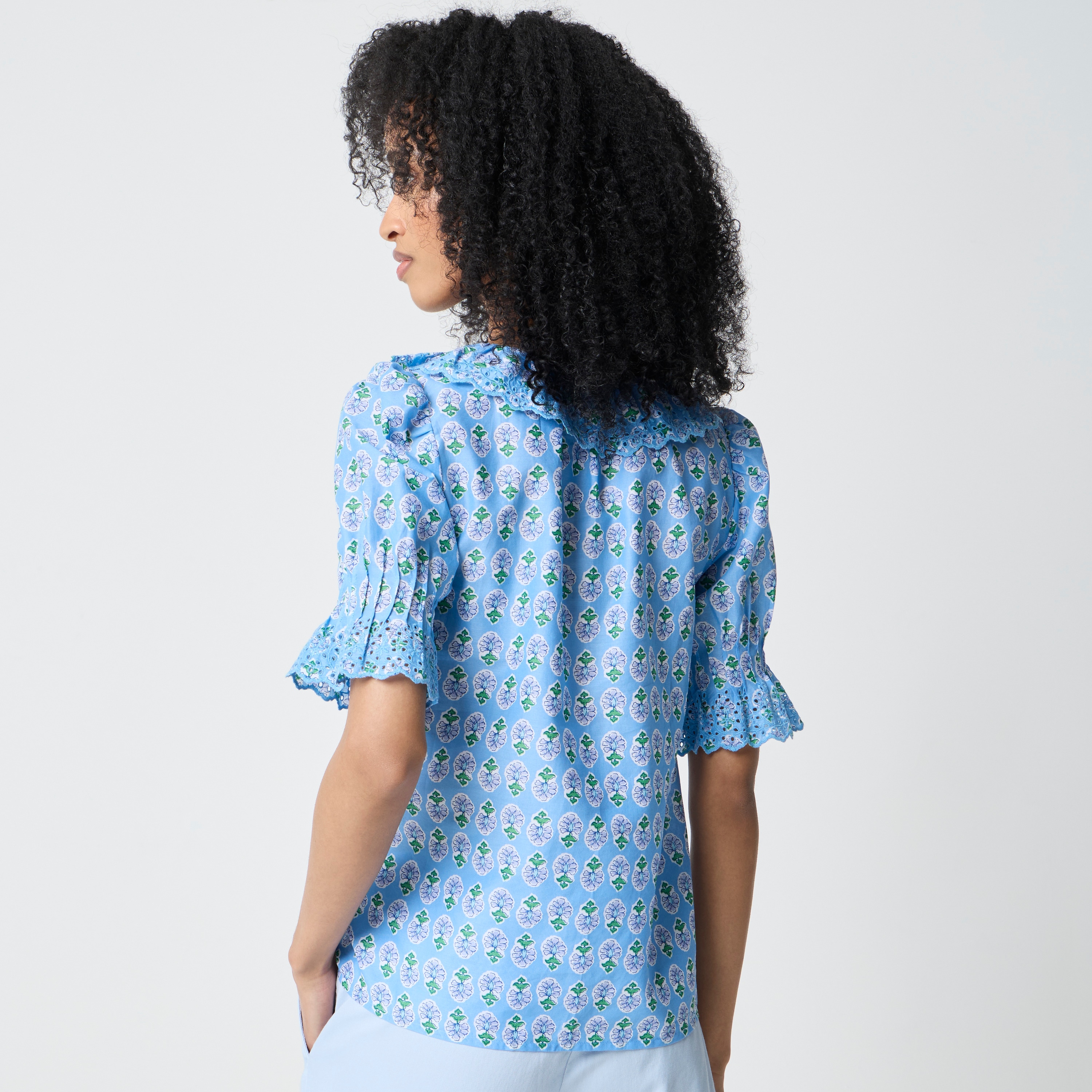 Eyelet ruffle-front top