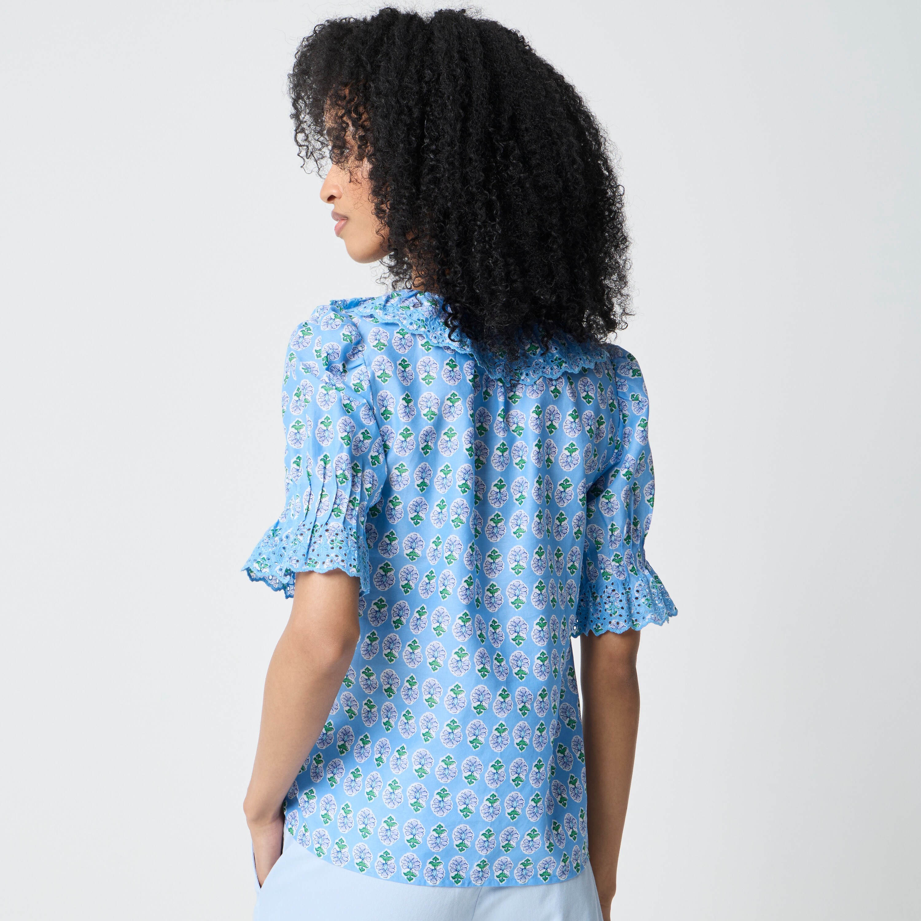 Eyelet ruffle-front top