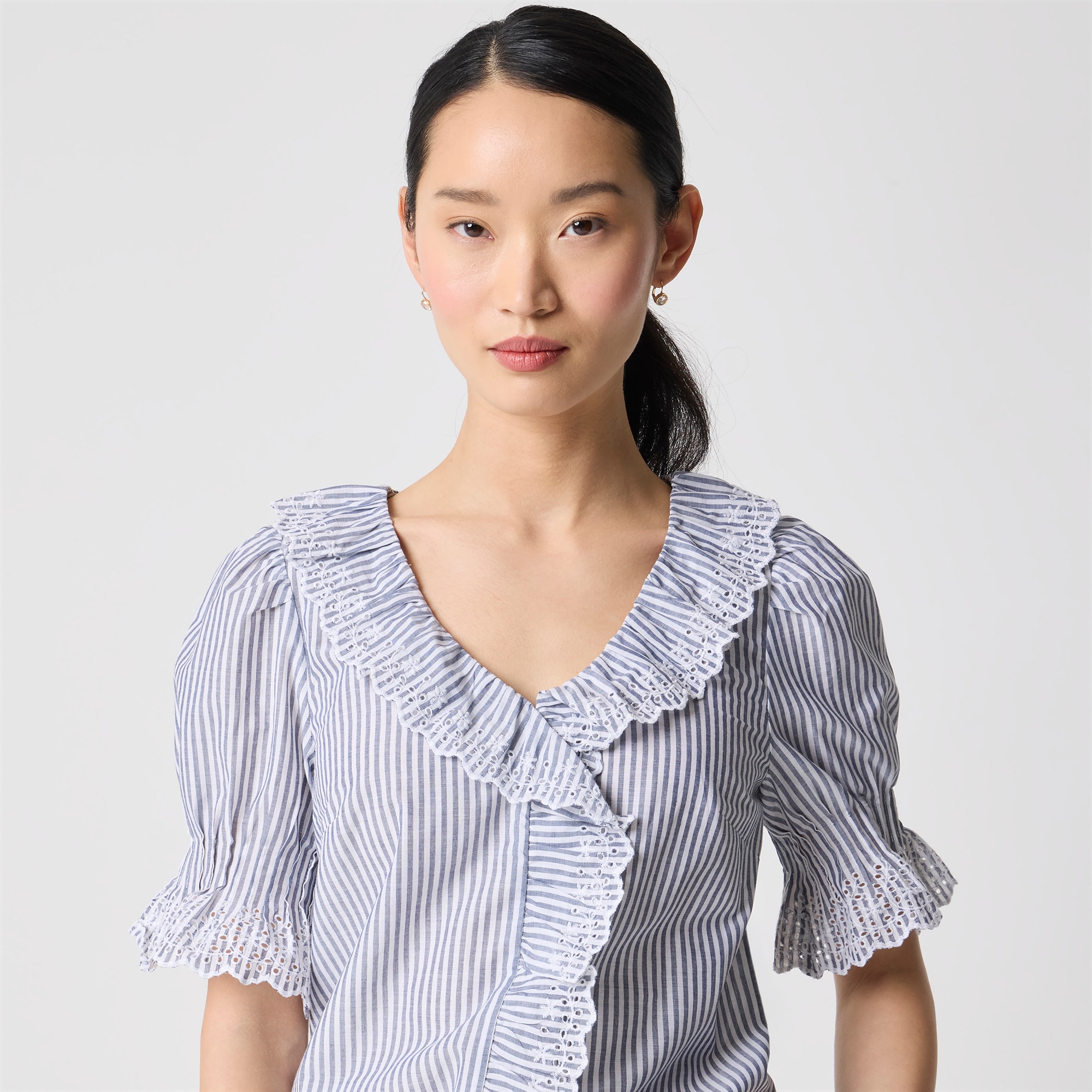 Striped eyelet ruffle-front top