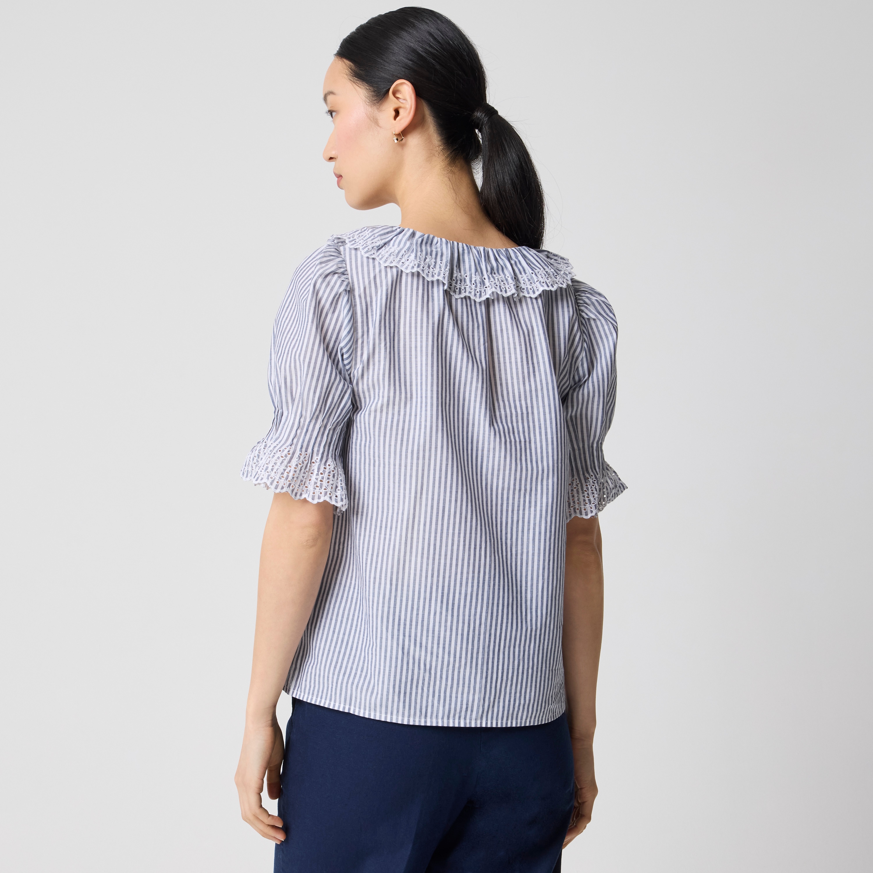 Striped eyelet ruffle-front top