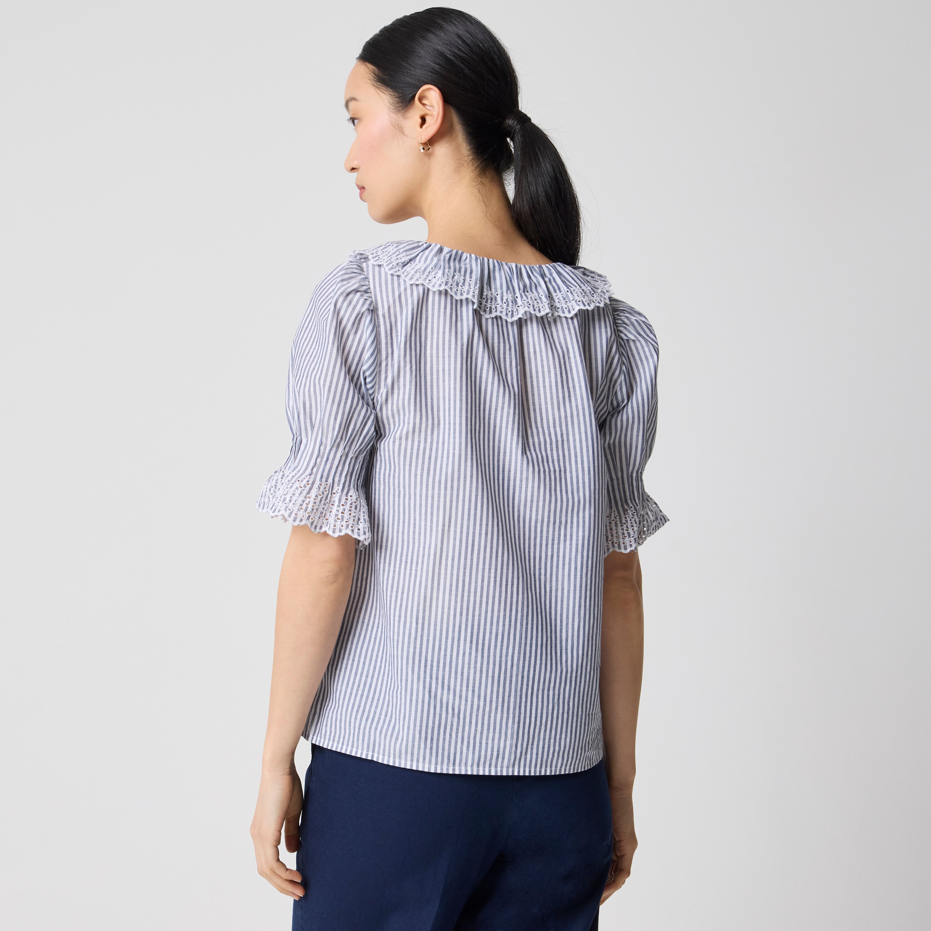 Striped eyelet ruffle-front top
