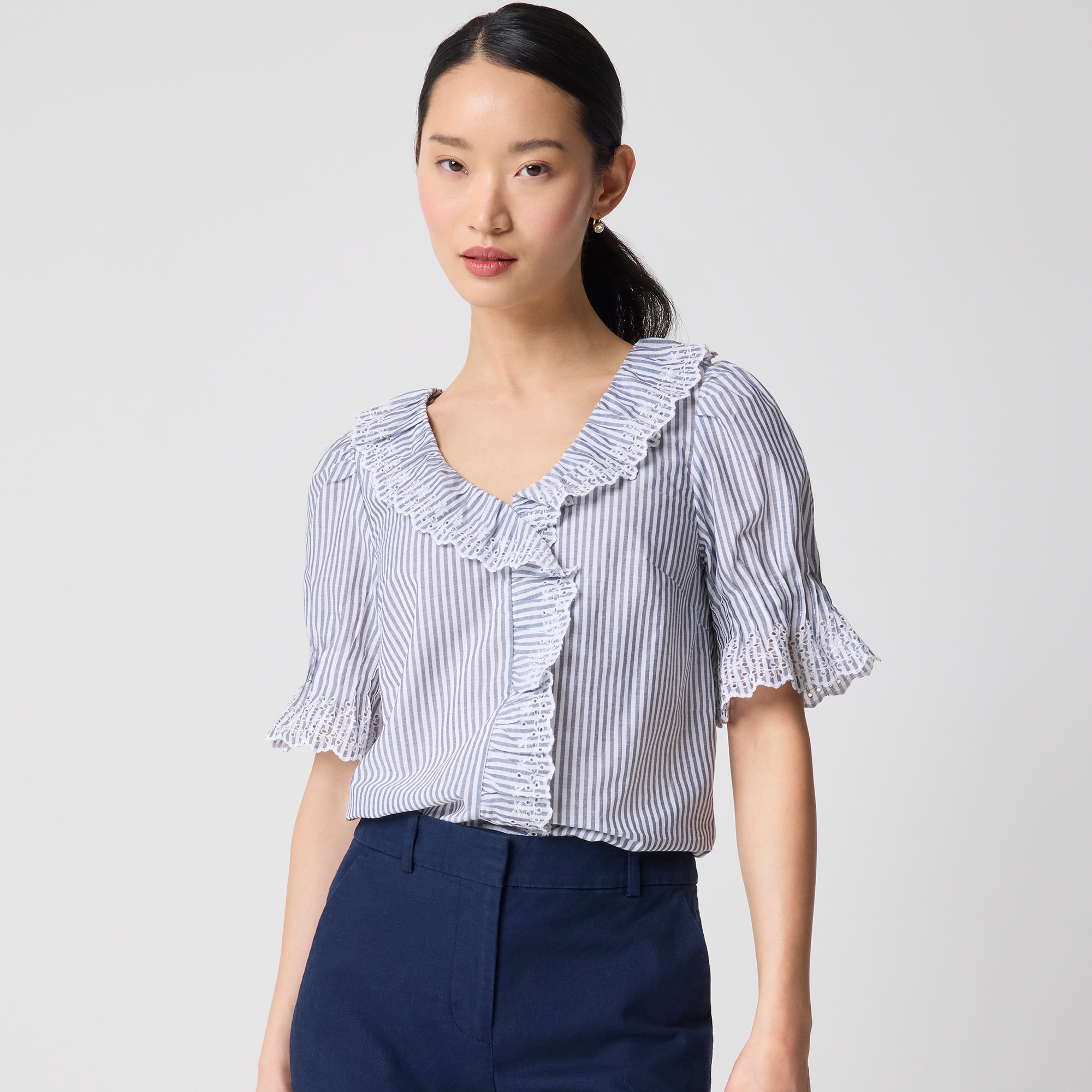 Striped eyelet ruffle-front top