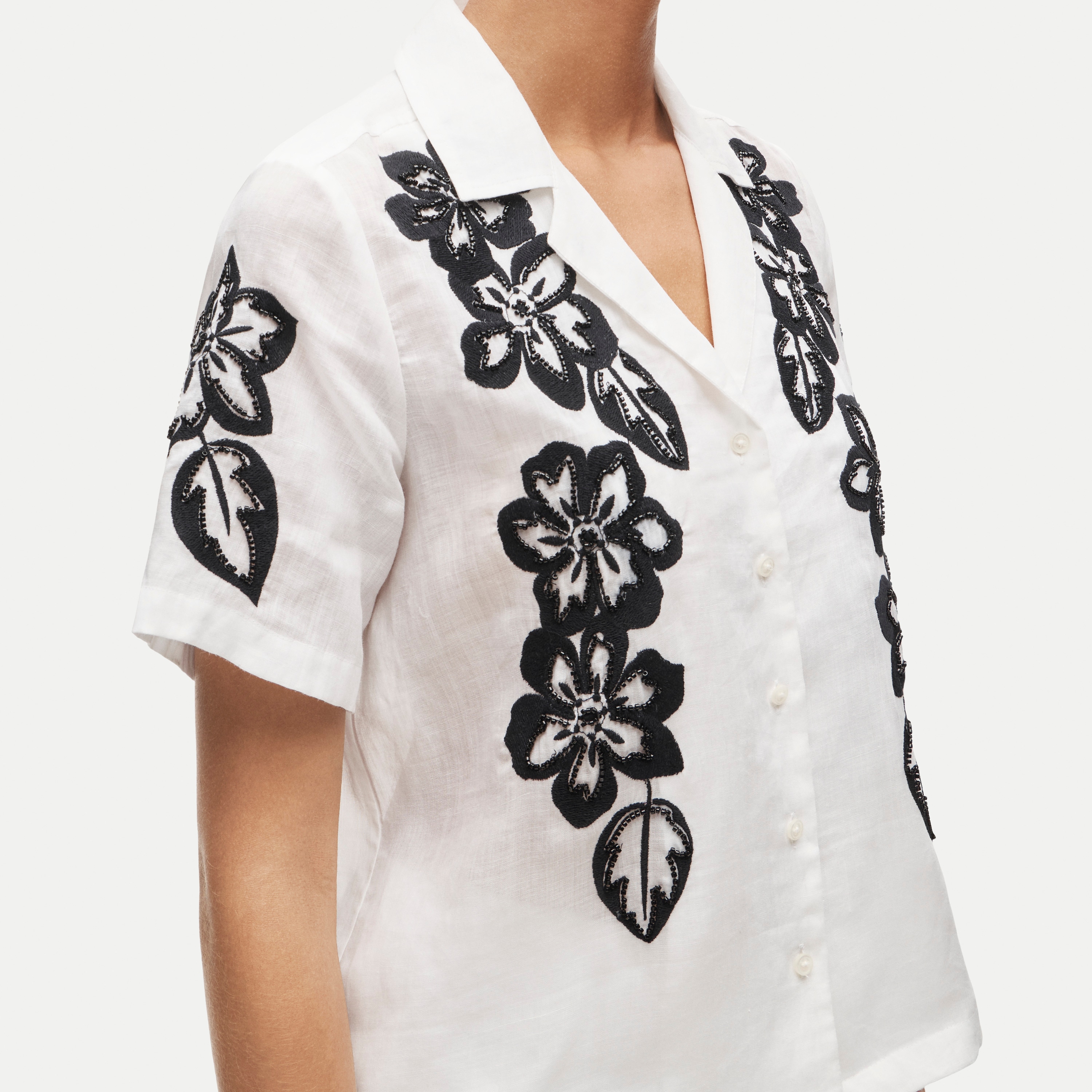 Short-sleeve button-up top in beaded floral