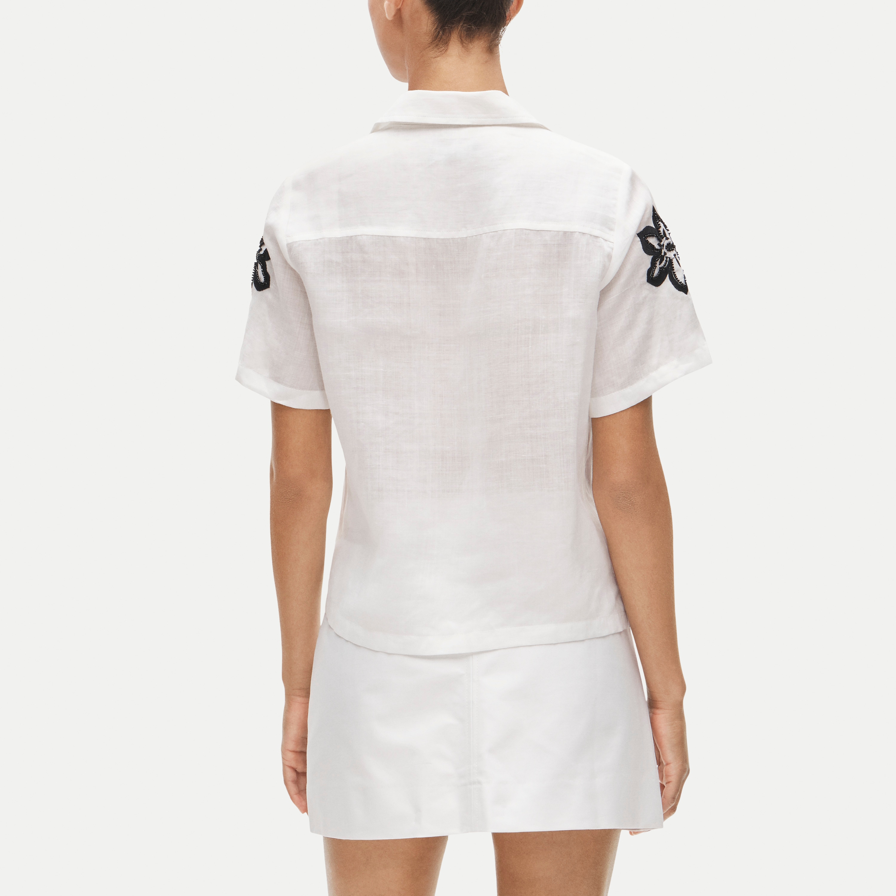 Short-sleeve button-up top in beaded floral