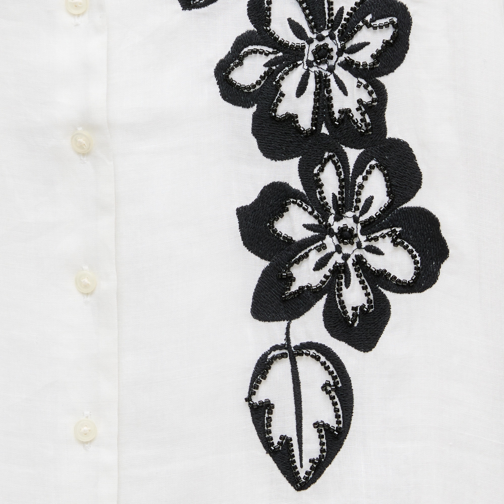 Short-sleeve button-up top in beaded floral