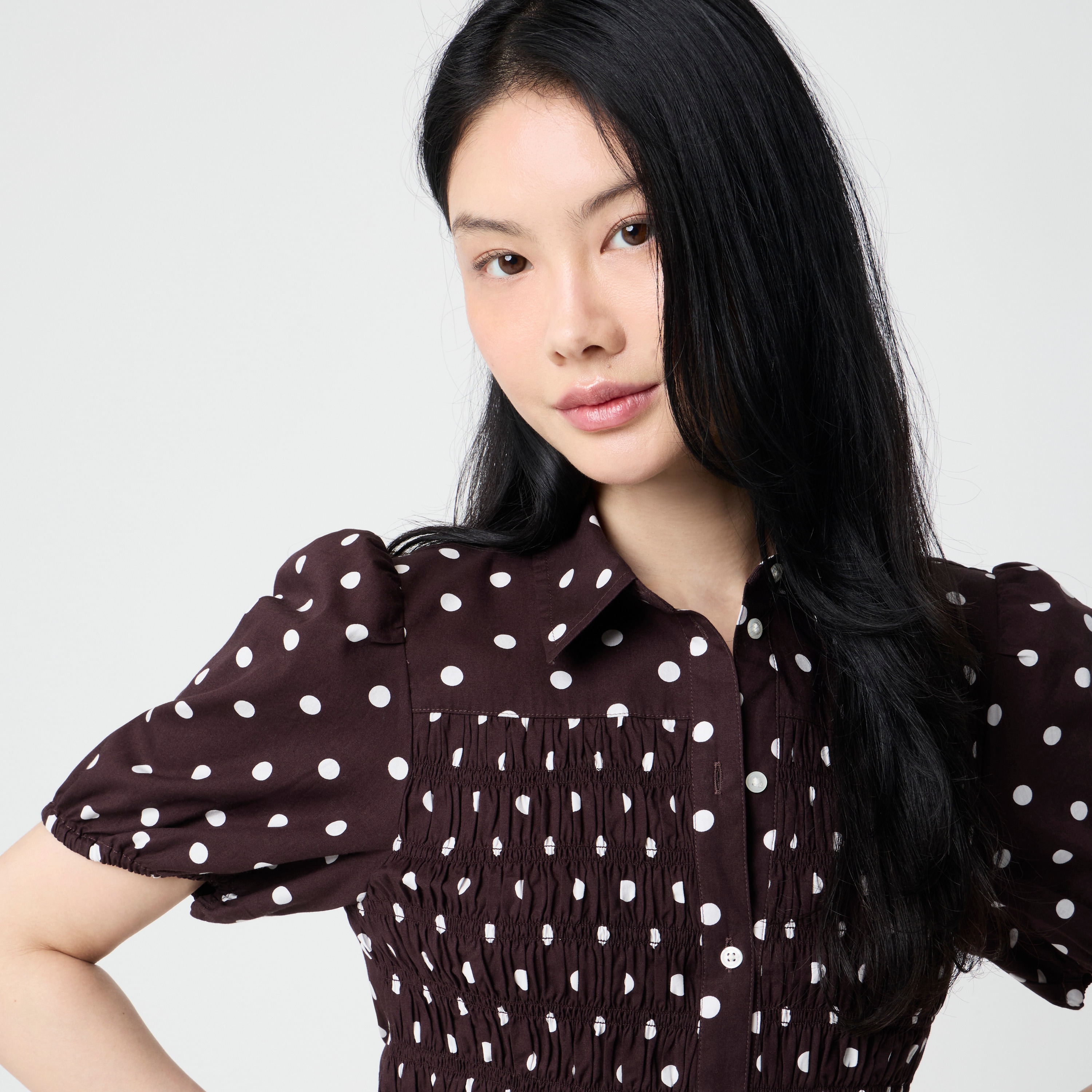 Polka-dot smocked button-front top