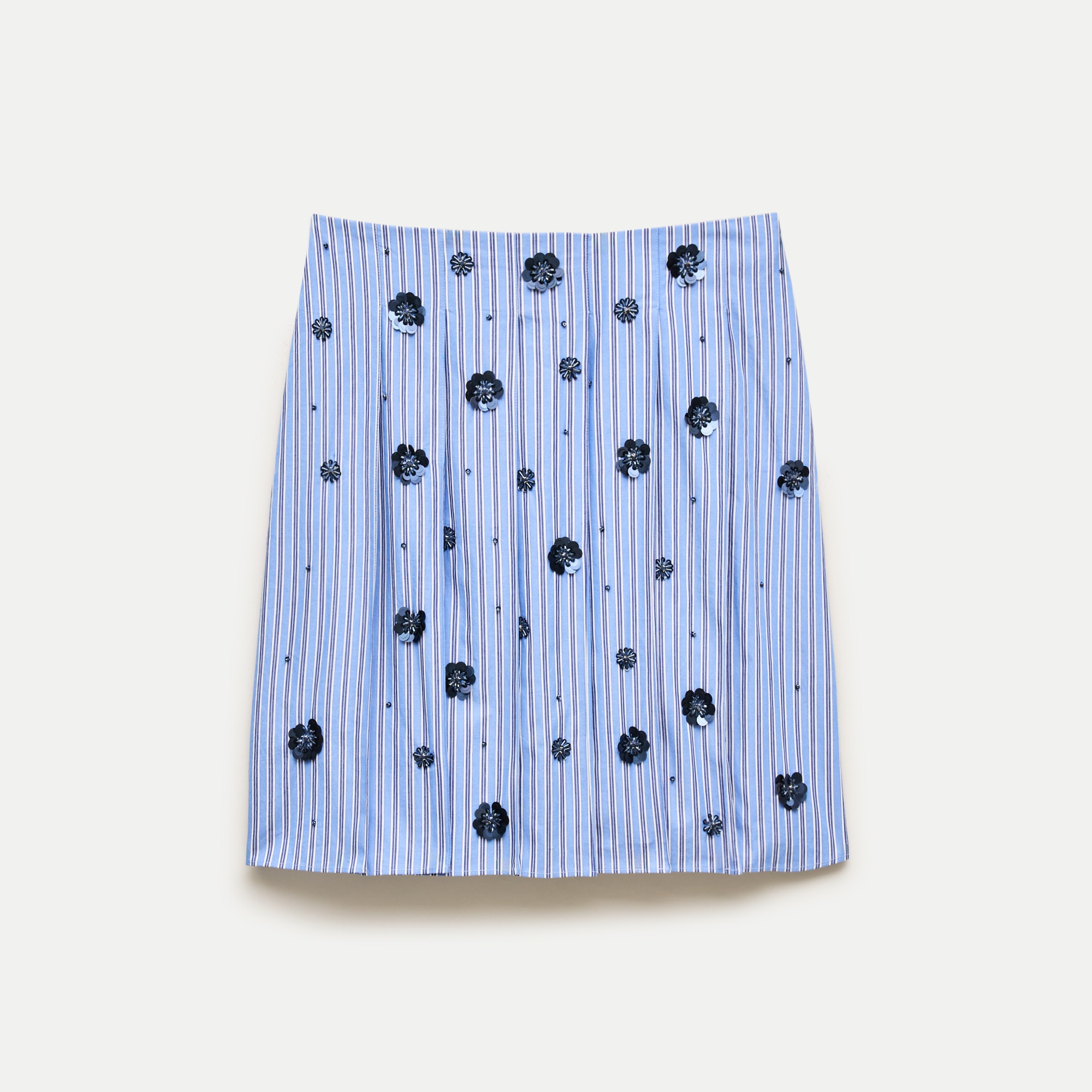 Pleated prep skirt in stripe with floral embellishments