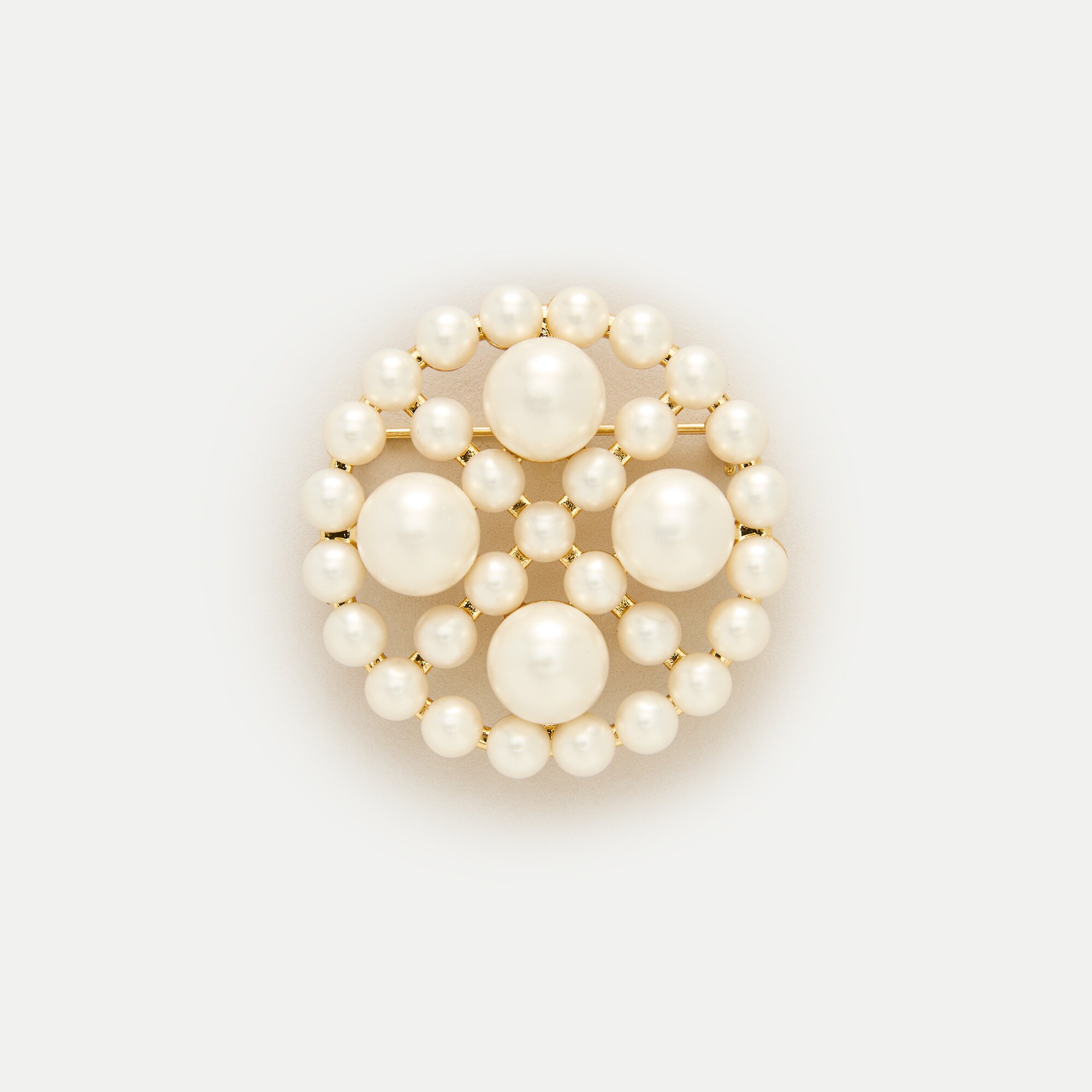 Circular pearl brooch