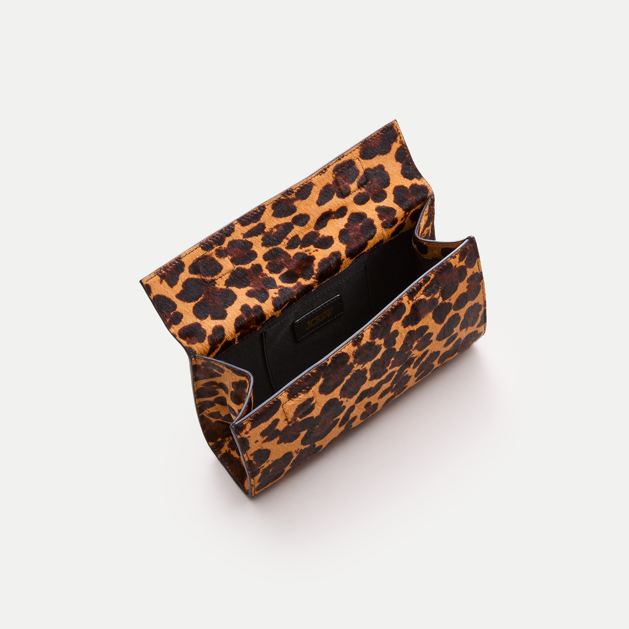 Structured clutch in leopard-print calf hair
