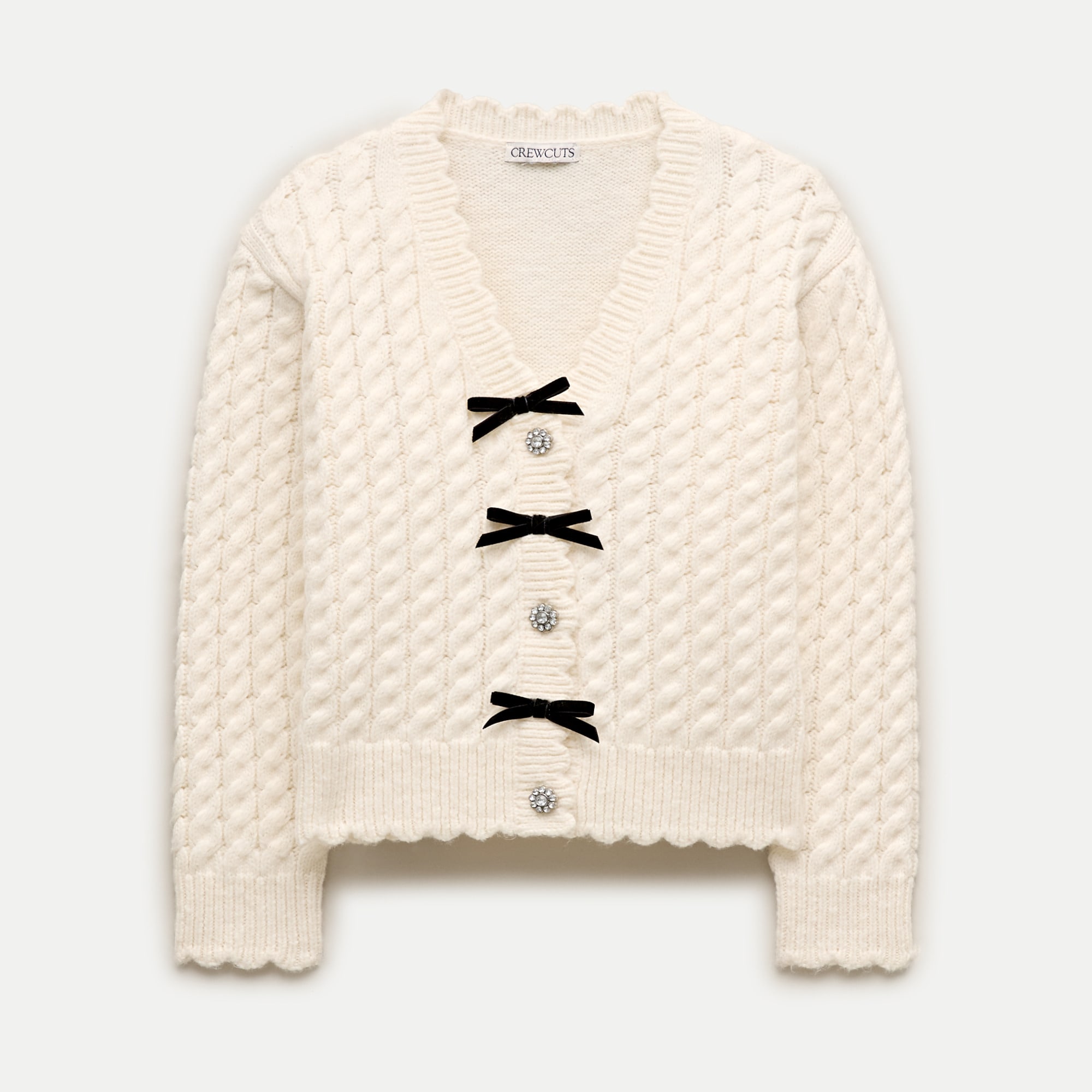 Girls' bow cable-knit cardigan in Supersoft yarn