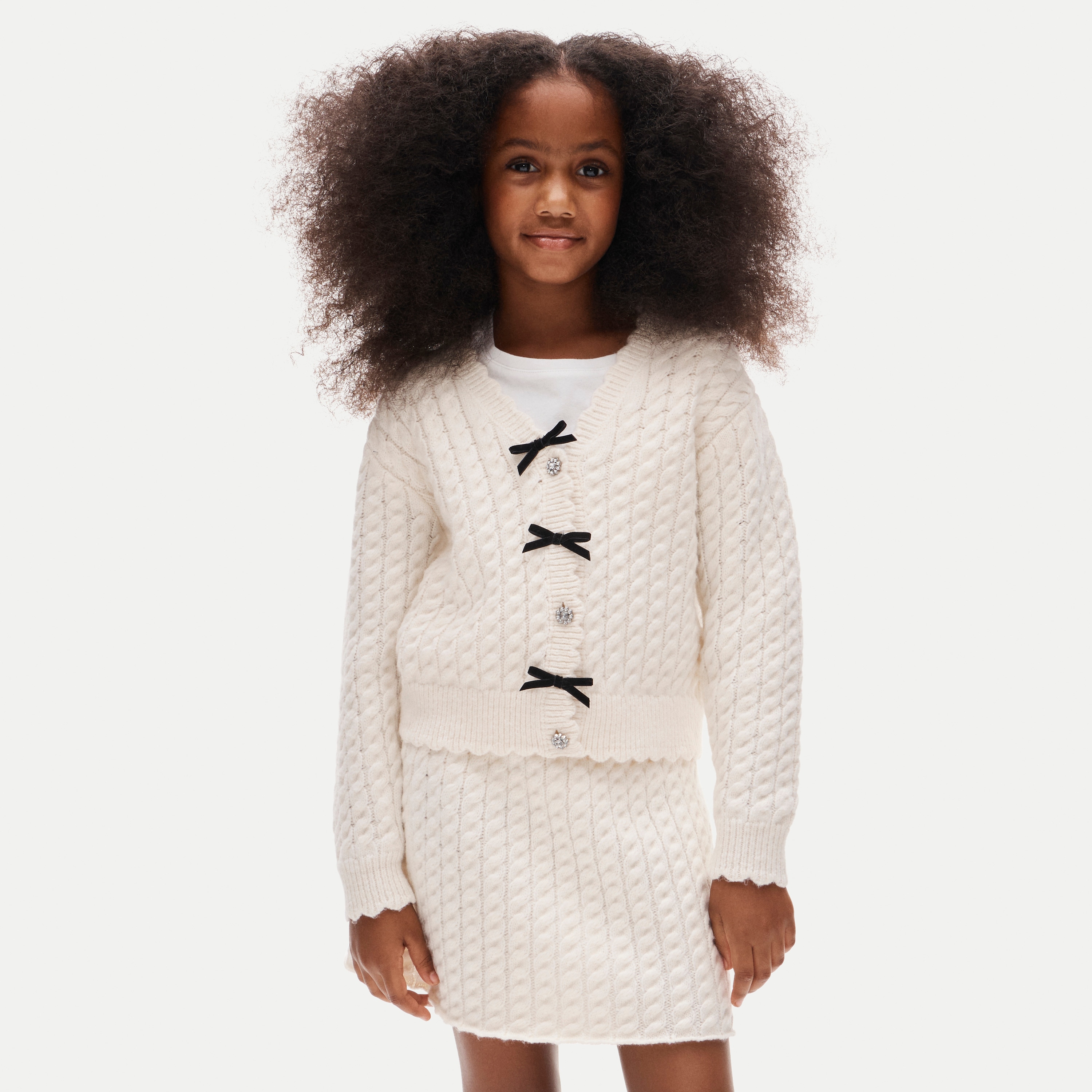 Girls' bow cable-knit cardigan in Supersoft yarn