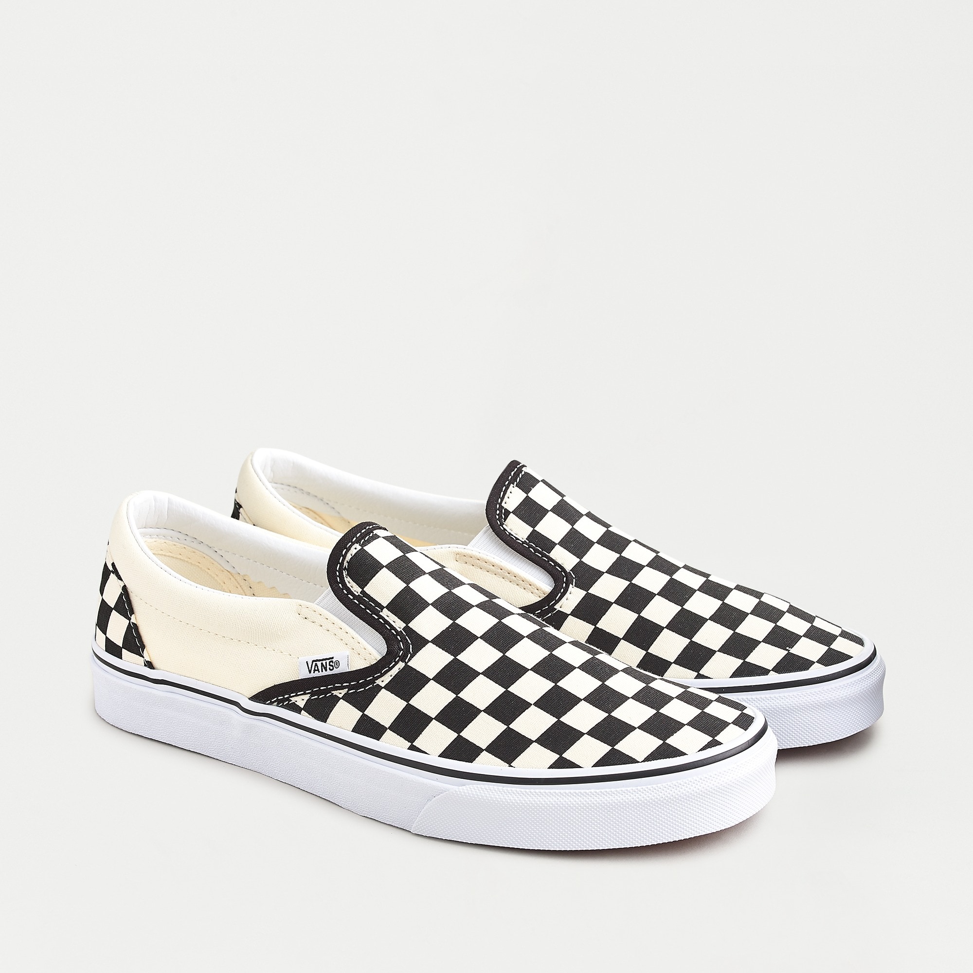 the checkerboard vans slip ons